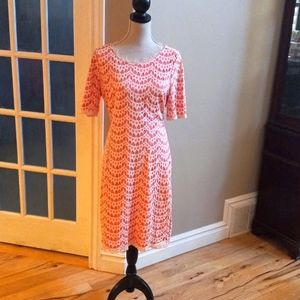 Large, orange and white lace knee length, short sleeved dress